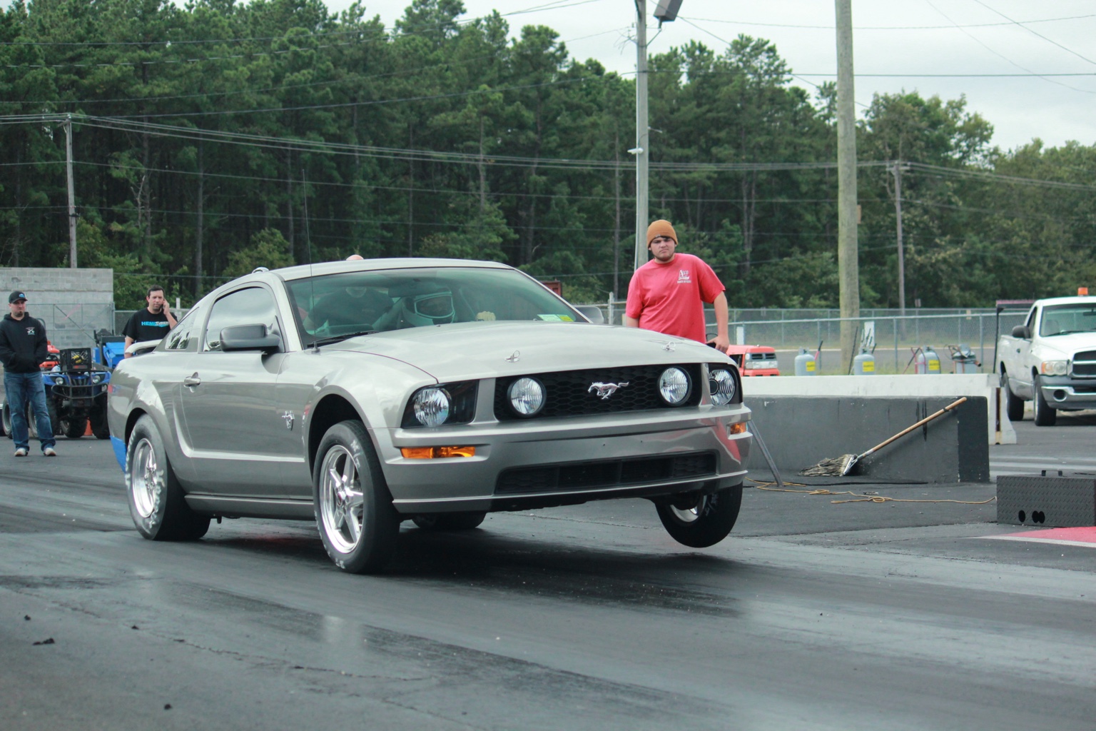 Family's silver Mustang GT launching at the drag strip